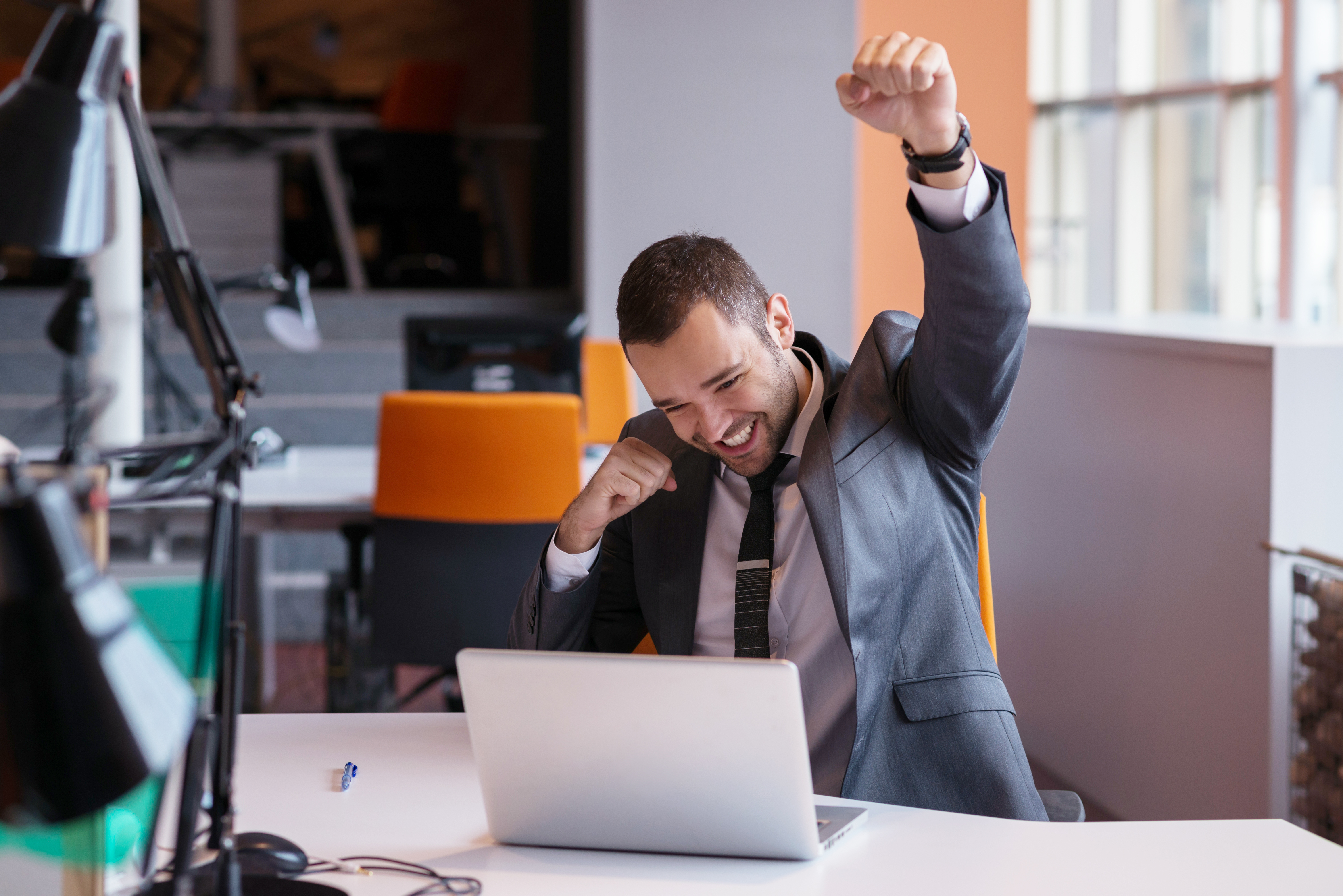 happy young business man portrait in bright modern office indoor
